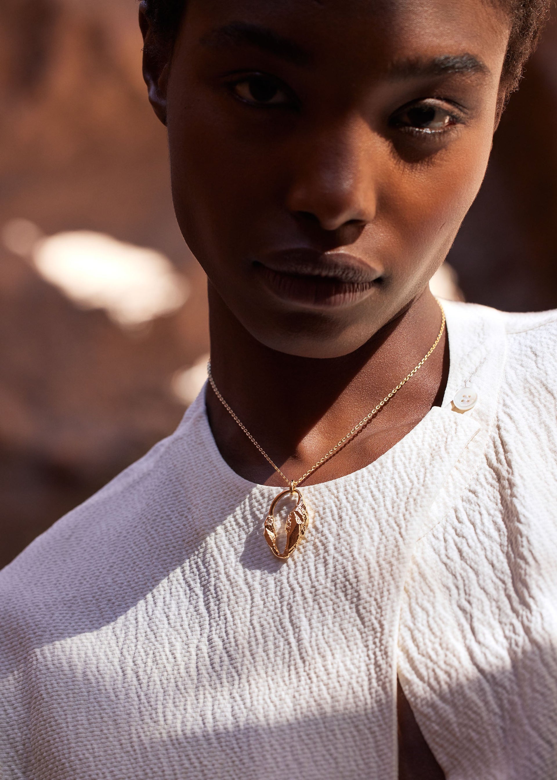 Colgante Eroz​ - chapada en oro de 24 quilates​